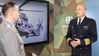 Zwei Soldaten stehen sich vor einem Monitor gegenüber und sprechen miteinander